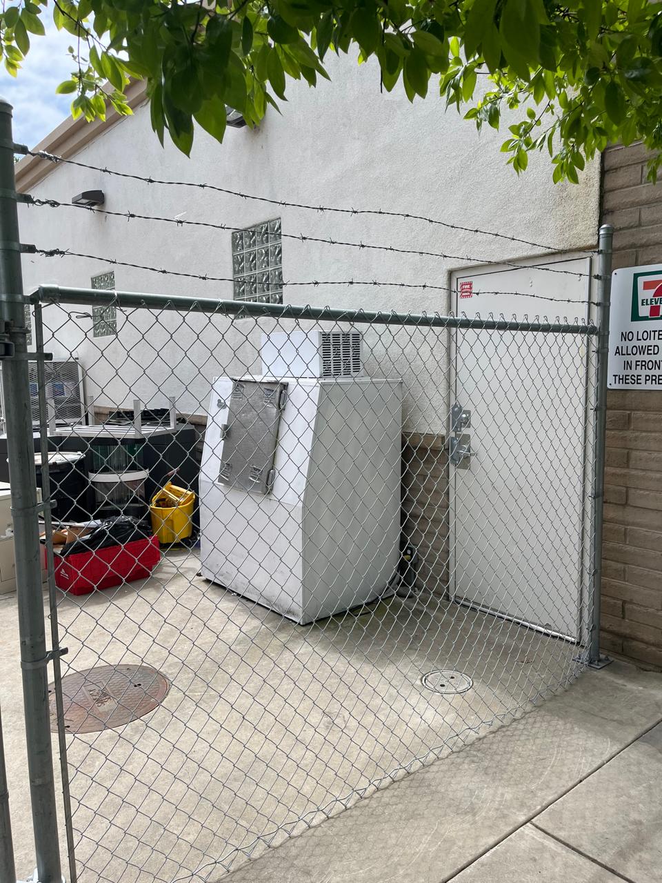 Exterior equipment secured by chain-link enclosure